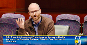 Photo of University Health Professionals (UHP) member Paul Banach, RN  speaking