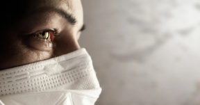 Stock photo of caregiver in tears